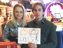 парень и девушка русоволосая держат шарж в Мулен Руж